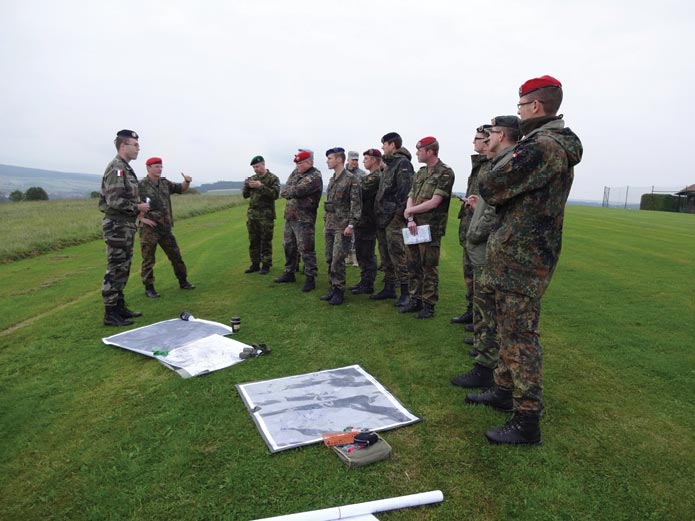 Students of the 10th Joint Lehrgang General- und Admiralstabsdienst receive instructions on the German army decision-making process 10 September 2014 during a tactical exercise without troops in Uslar, Germany