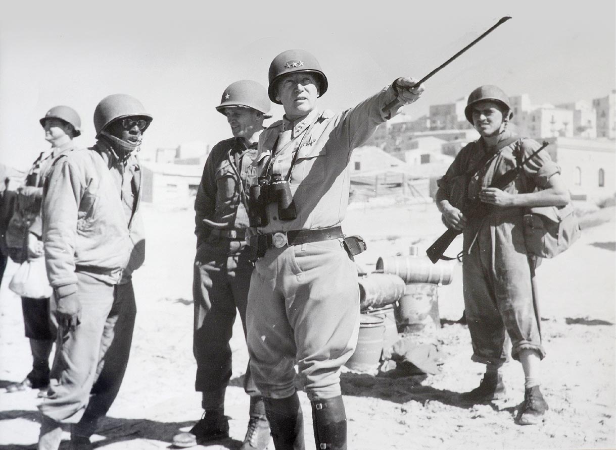 Gen. George S. Patton Jr. provides guidance to subordinate commanders during the military campaign for Sicily in 1943. (Photo courtesy of Foy S. McNaughton, McNaughton Newspapers)