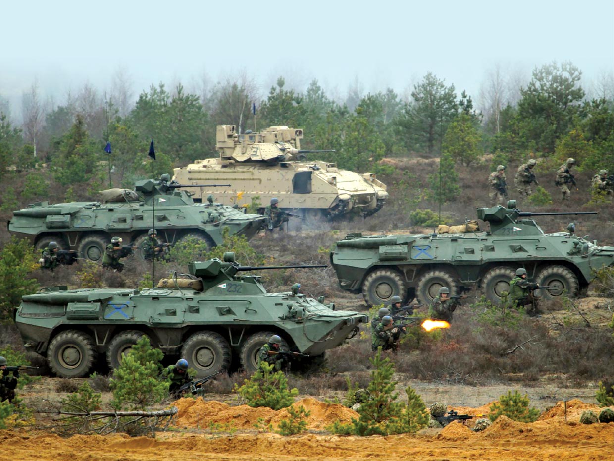 U.S. soldiers from 2nd Battalion, 8th Cavalry Regiment, 1st Brigade Combat Team, 1st Cavalry Division, dismount a Bradley Fighting Vehicle