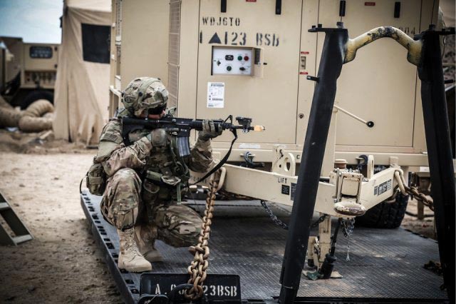 A soldier from 123rd Brigade Support Battalion, 3rd Brigade Combat Team, 1st Armored Division, provides security