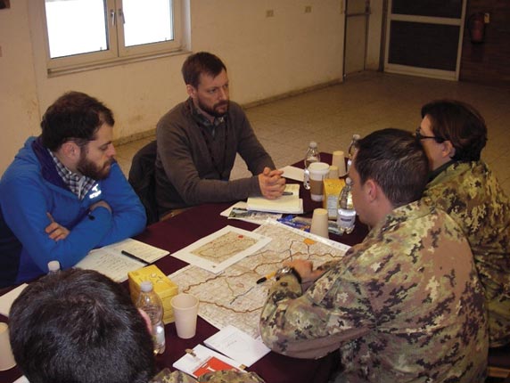 United Nations High Commission for Refugees representatives meet with Italian civil-military cooperation officers during Exercise Allied Spirit 5