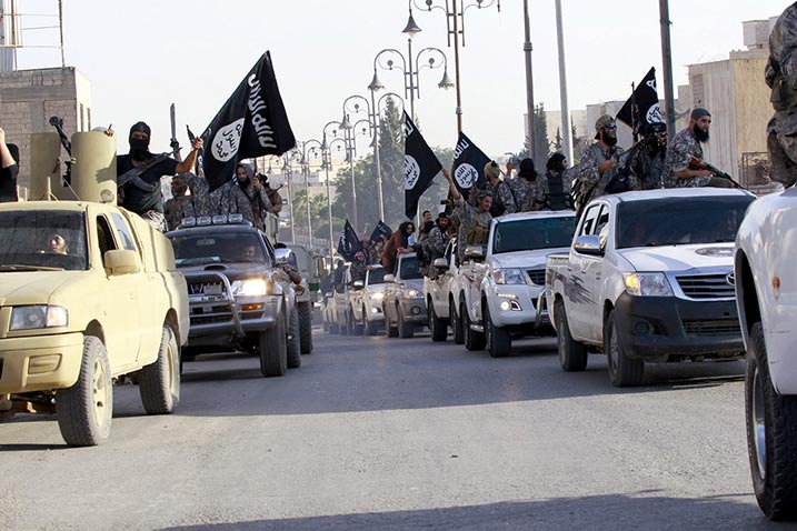 Militant Islamist fighters parade 30 June 2014 in the streets of northern Raqqa Province, Syria