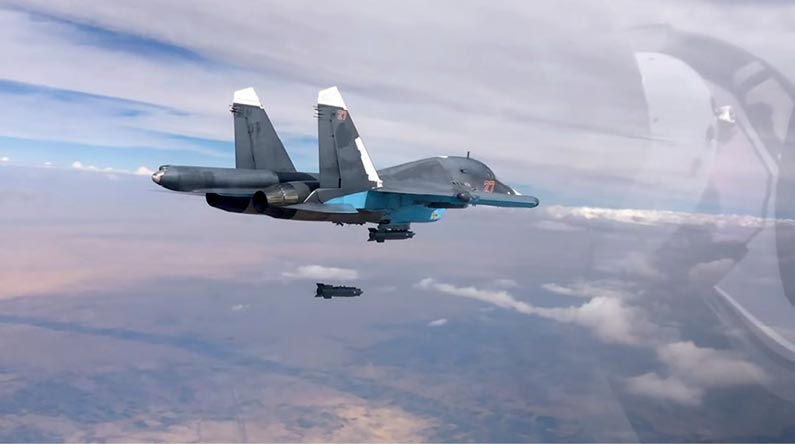 A Russian Sukhoi Su-34 fighter-bomber aircraft drops a KAB-500S, a 560 kg satellite-guided bomb