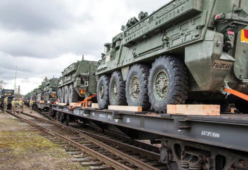 >Stryker combat vehicles belonging to Ghost Troop, 2nd Squadron, 2nd Cavalry Regiment wait to unload during a rail operation 21 April 2016 at Gaiziunai, Lithuania.