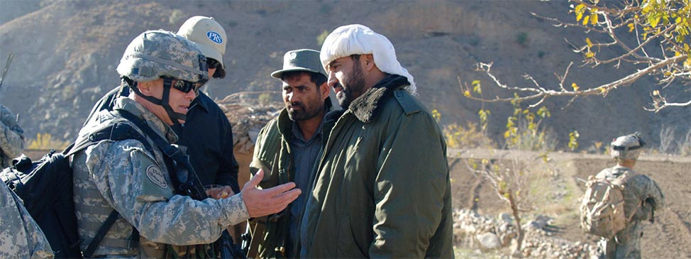 U.S. Army Brig. Gen. Anthony Tata, left, deputy commanding general for Security, Combined Joint Task Force 76, 10th Mountain Division, meets with Afghan Gen. Mulwana, right, and village elders during a key leaders engagement in the village of Landikheyl, Afghanistan, November 25, 2006. (Sgt . 1st Class Dexter D. Cloud en/ U.S. Army)