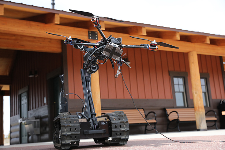 A QinetiQ Talon 5 robot moves a drone 7 May 2019