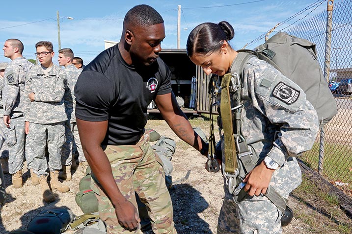 A jumpmaster assigned to the U.S. Army Advanced Airborne School (USAAAS) rigs a cadet