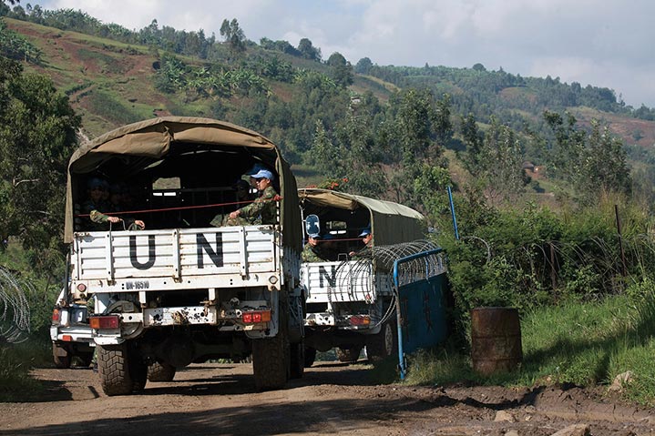 United Nations (UN) trucks transport the military personnel of the Chinese engineering company