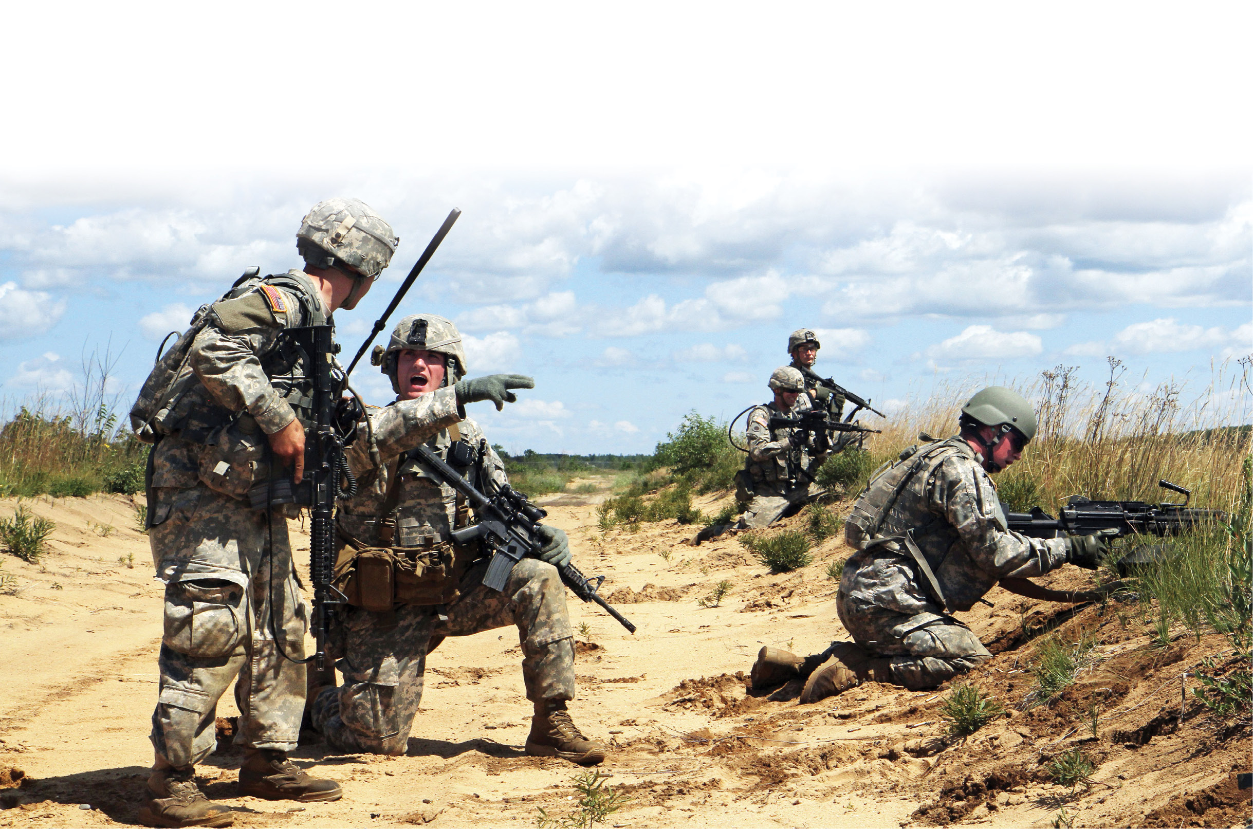 Sgt. Gregory Padilla (second from left) gives a status report to 2nd Lt. Randy Jozwiak (left) during a live-fire exercise 20 July 2015 as part of Northern Strike 15 on Camp Grayling Joint Maneuver Training Center, Michigan. Padilla is a team leader and Jozwiak is a platoon leader assigned to the 1st Battalion, 126th Cavalry Regiment. (Photo by Sgt. Seth LaCount, U.S. Army)