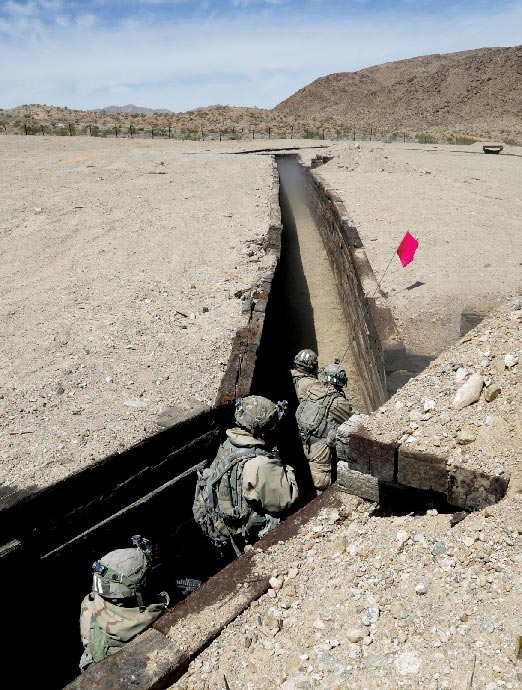 Soldiers assigned to 2nd Battalion, 3rd Infantry Regiment, 1st Brigade Combat Team, 2nd Infantry Division, clear a trench