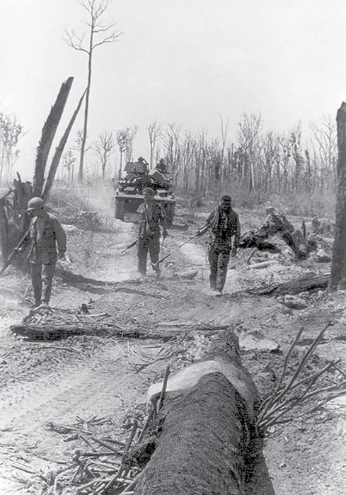 Engineers supported by a M551 Sheridan Tank from the Blackhorse Regiment clear mines 31 December 1969 in Cambodia.