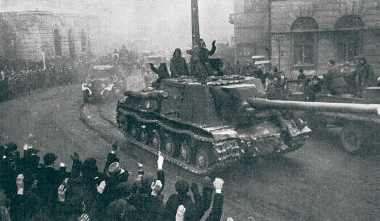 Residents of Lodz, Poland, greet Soviet tank crews in 1945 as they enter the city. (Photo courtesy of the State Archive of the Russian Federation)