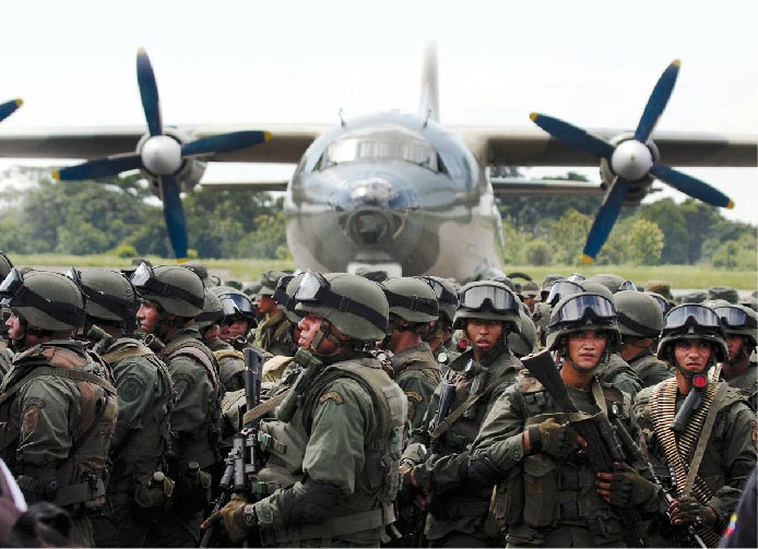 Venezuelan special forces troops deplane from a Venezuelan Air Force Chinese-made Y-8F-100 transport aircraft 1 September 2015 close to the Venezuela-Colombia border in La FrÍa