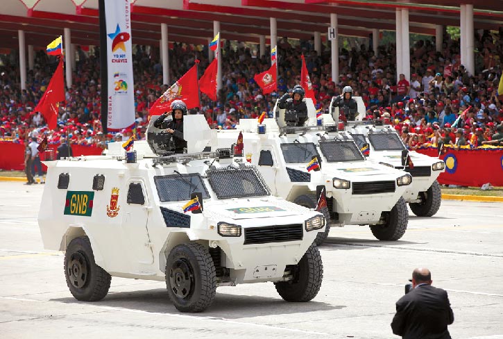 Venezuela’s Chinese-made, light-armored VN-4 “Rhinoceros” personnel carriers drive 5 March 2014 in a parade commemorating the death of Hugo Chavez in Caracas