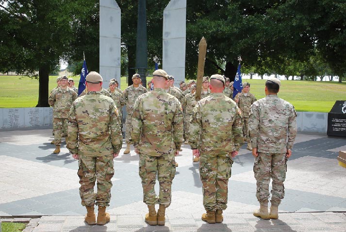 The Ranger Regiment command team prepares to unfurl the Regimental Military Intelligence Battalion colors