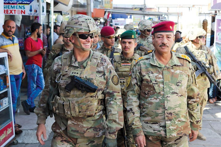 Lt. Gen. Paul E. Funk II (<em>left</em>), then commanding general of Combined Joint Task Force-Operation Inherent Resolve, and Iraqi Maj. Gen. Najm Abdullah al-Jibouri (<em>right</em>), commander of Nineveh Liberation Operation
