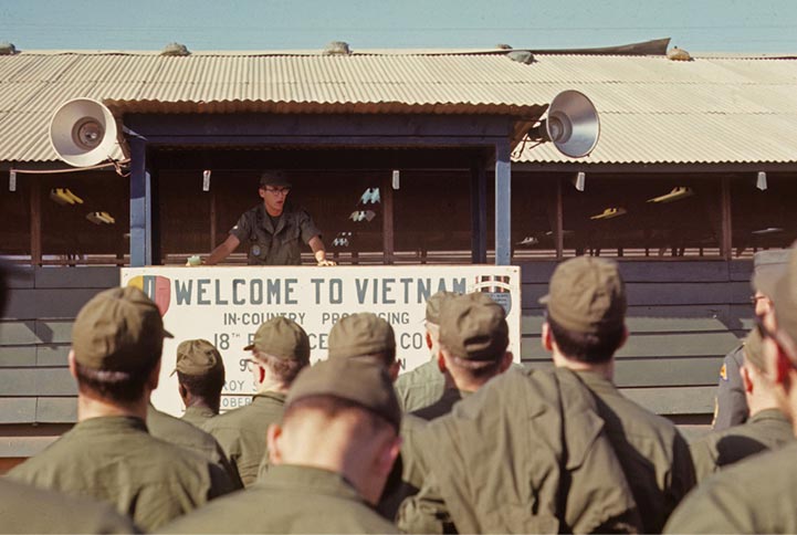 A soldier from the 18th Replacement Company of the 90th Replacement Battalion processes newly arrived Army troops January 1970 at the Long Binh Processing Center in Vietnam.