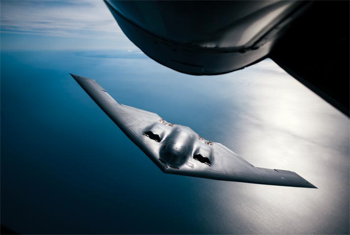 An Air Force B-2 Spirit bomber approaches a KC-135 Stratotanker for refueling 29 August 2019 during a training exercise over England.