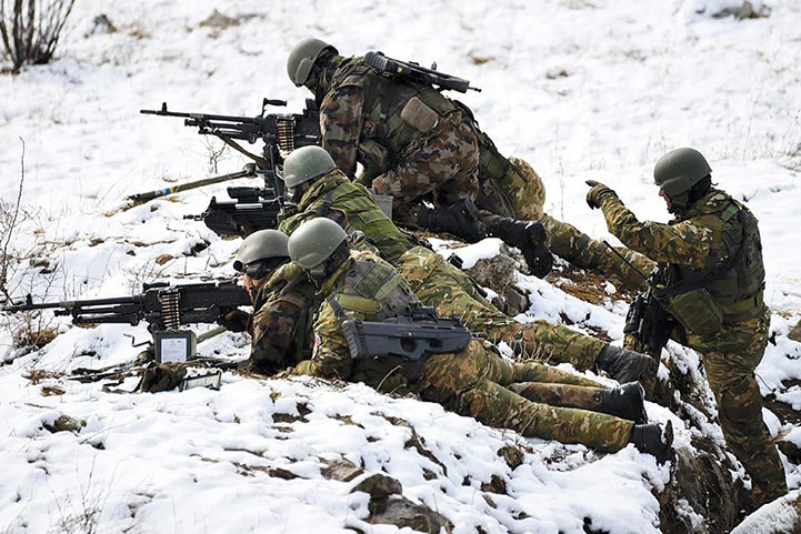 A Slovenian Armed Forces machine-gun squad conducts live-fire training in 2015 at the Central Firing Range and Training Area (OSVAD) Postojna–Poček, Slovenia.