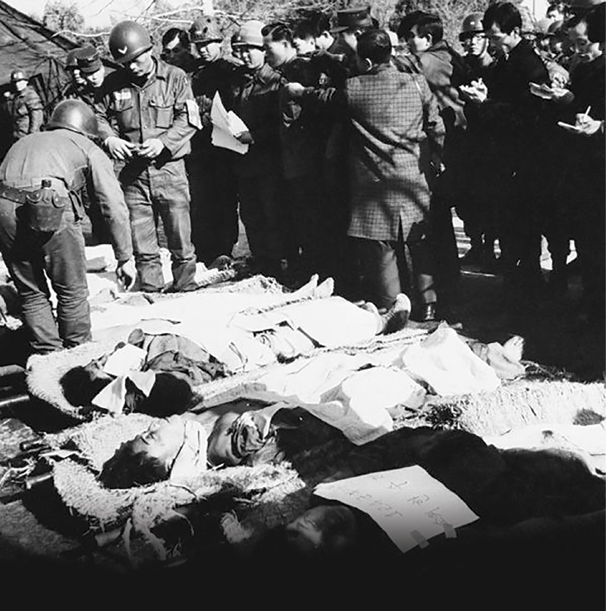 U.S. and South Korean troops inspect the bodies of North Korean special forces infiltrators killed during the January 1968 “Blue House”