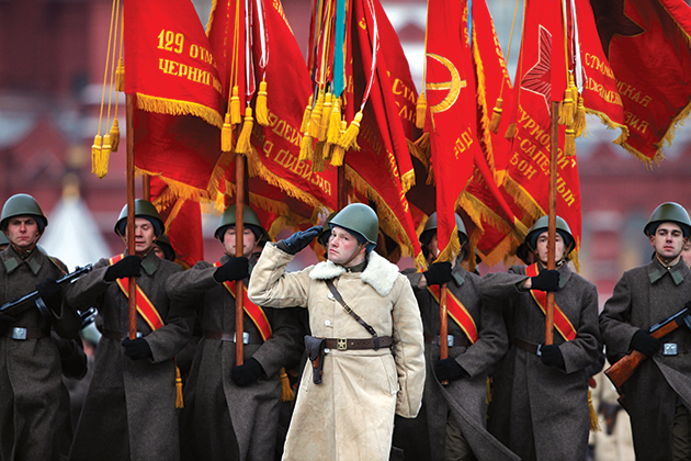 russian soldier war hero with a flag against the