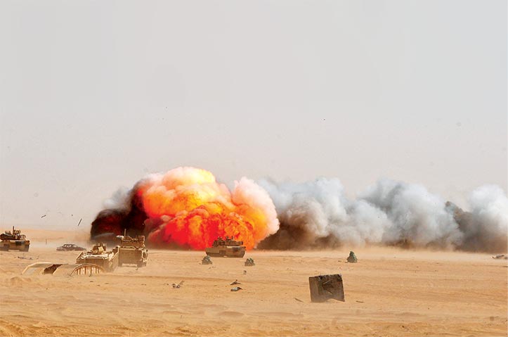 Engineers assigned to the 588th Brigade Engineer Battalion, 3rd Armored Brigade Combat Team, 4th Infantry Division, employ an M58 Mine Clearing Line Charge 9 July 2015 during a breaching training exercise at the Udairi Range Complex, Kuwait.