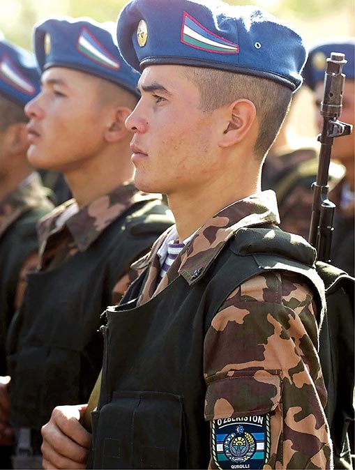 Uzbekistan soldiers pass in review 13 September 2000 during the Central Asian Peacekeeping Battalion (CENTRASBAT) 2000 opening ceremonies in Kazakhstan.