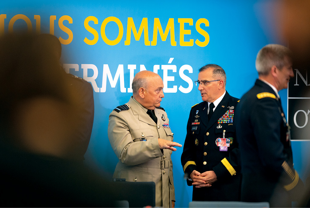 In an example of an “away from the table” activity, Gen. Curtis M. Scaparrotti, supreme allied commander Europe, engages Air Chief Marshal Sir Stuart Peach, chairman of the NATO Military Committee, during the third session of the North Atlantic Council 12 July 2018 at the Brussels Summit in NATO headquarters, Brussels. Scaparrotti attended the summit to provide military guidance to the North Atlantic Council and to meet with military and political leadership from throughout the Alliance. (Photo by Tech. Sgt. Cody H. Ramirez, U.S. Air Force/NATO) 