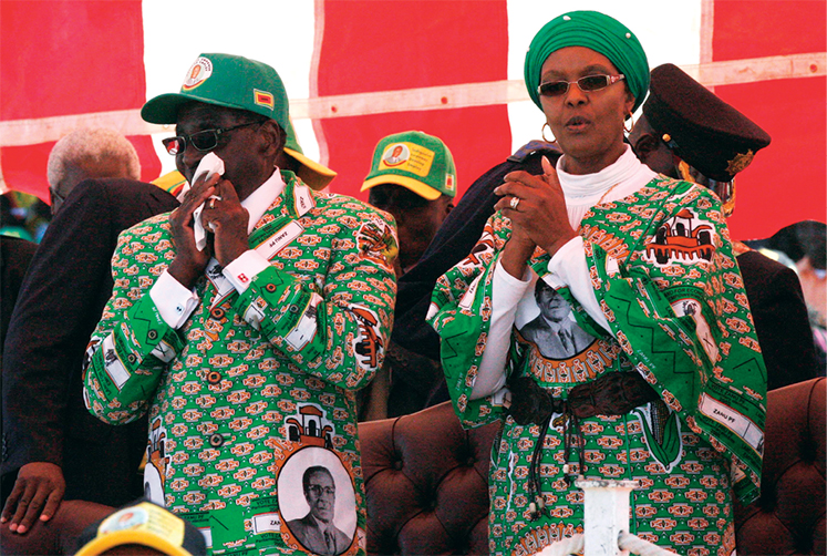 Members of parliament celebrate 21 November 2017 after President Robert Mugabe’s resignation in Harare, Zimbabwe.