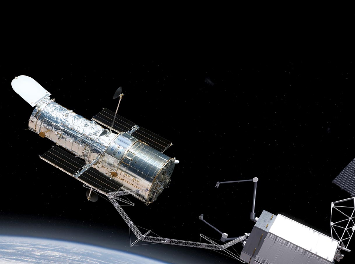 A U.S. satellite uses a robotic arm to capture the Hubble Telescope satellite