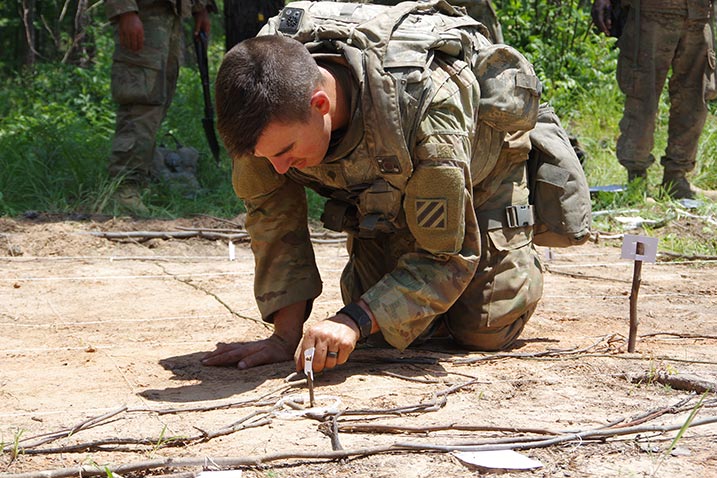 A Georgia National Guard soldier from the 48th Infantry Brigade Combat Team prepares a sand table 