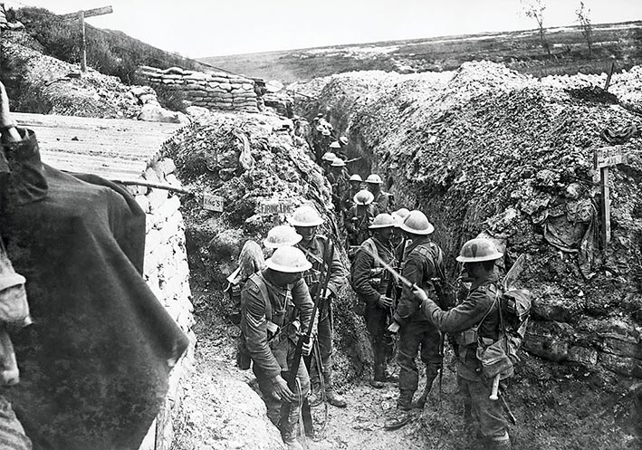 Soldiers of the 1st Battalion, Lancashire Fusiliers, fix bayonets in a communication trench 1 July 2016 prior to the attack on Beaumont Hamel