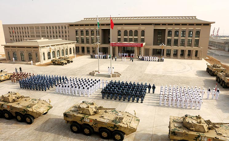 Chinese People’s Liberation Army personnel attend the opening ceremony of China’s new military base 1 August 2017 in Djibouti