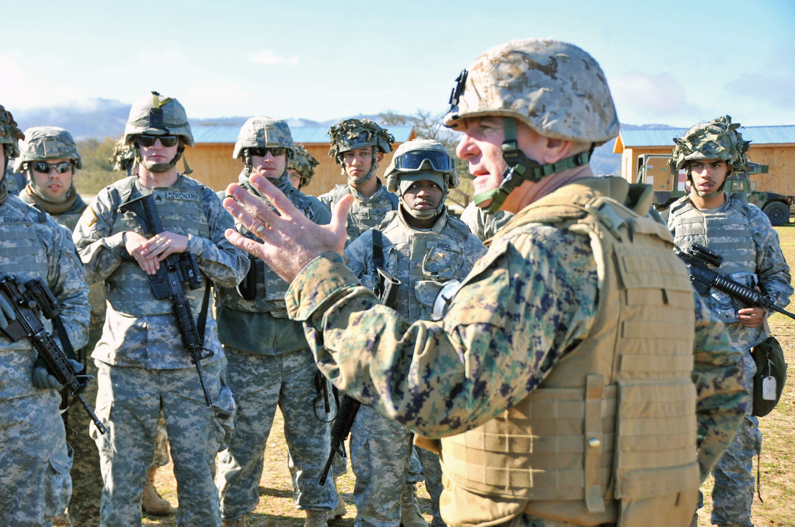 Marine Corps Sgt. Maj. Bryan B. Battaglia, senior enlisted advisor to the chairman of the Joint Chiefs of Staff, visits National Guard Soldiers performing artillery live-fire training Jan. 12, 2013, at Camp Roberts, Calif. (Photo courtesy of the SEAC)