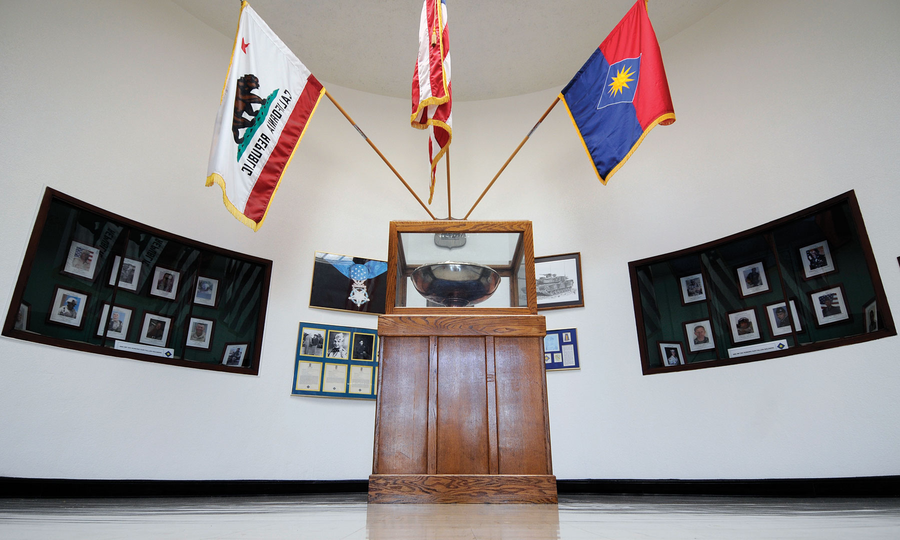 A silver punch bowl, made to commemorate fighting during the Korean War, sits at the headquarters of the 40th Infantry Division at Los Alamitos Joint Forces Training Base, Calif. The division’s Medal of Honor winners are also on display. (Photo by Jonathan (Jay) Koester)