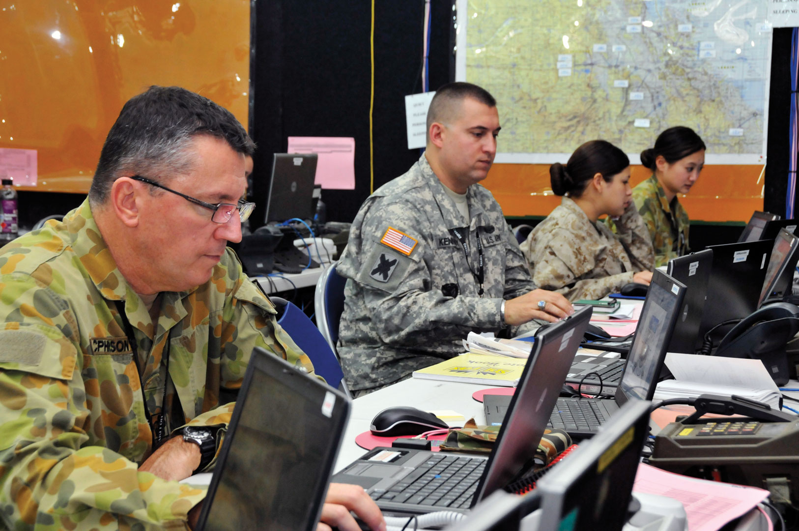 As part of a joint task force, Master Sgt. Timothy Kennedy of the 40th ID works side by side with soldiers from the Australian army and a U.S. Marine in July 2011 during Exercise Talisman Sabre 2011 at Kokoda Barracks, Queensland, Australia. (Photo by Staff Sgt. Emily Suhr)