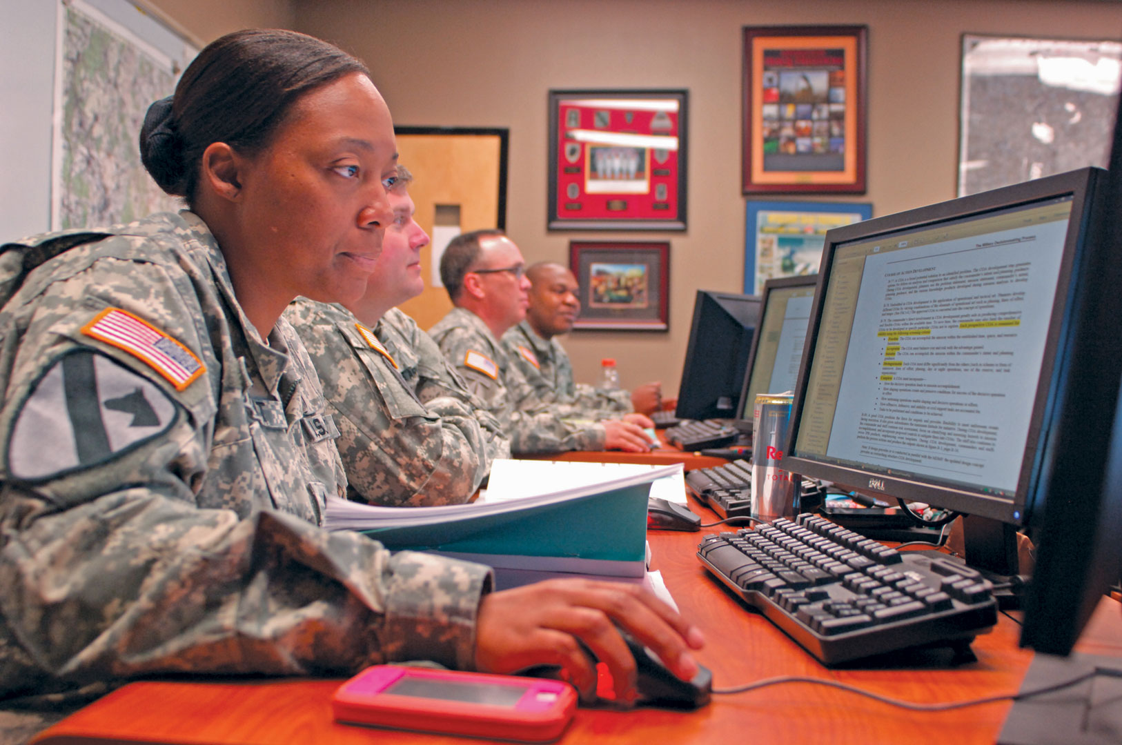 Staff Sgt. Chantel Duhart of the 1st Stryker Brigade Combat Team, 1st Armored Division, reviews course work during a resident Battle Staff NCO Course class at the U.S. Army Sergeants Major Academy at Fort Bliss, Texas. (Photo by Staff Sgt. Jason Stadel)
