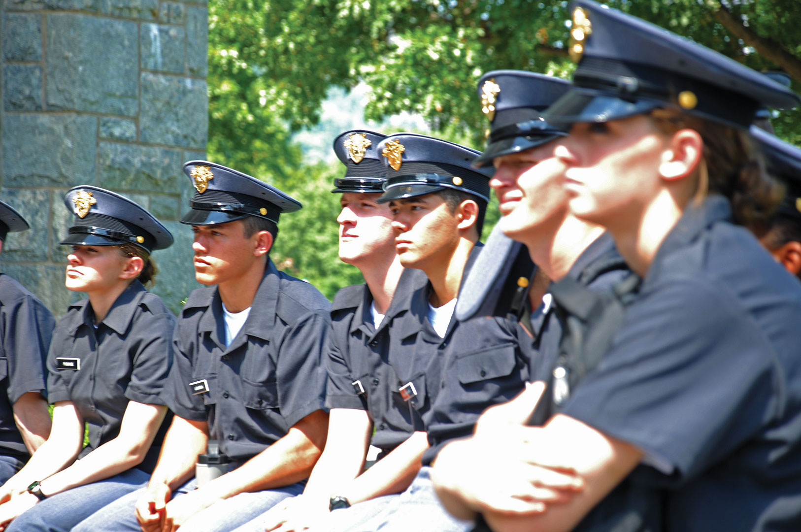 A class of cadets sits outside listening to a lecture about the Cadet Code. (Photo by Christy Lattimore-Staple)