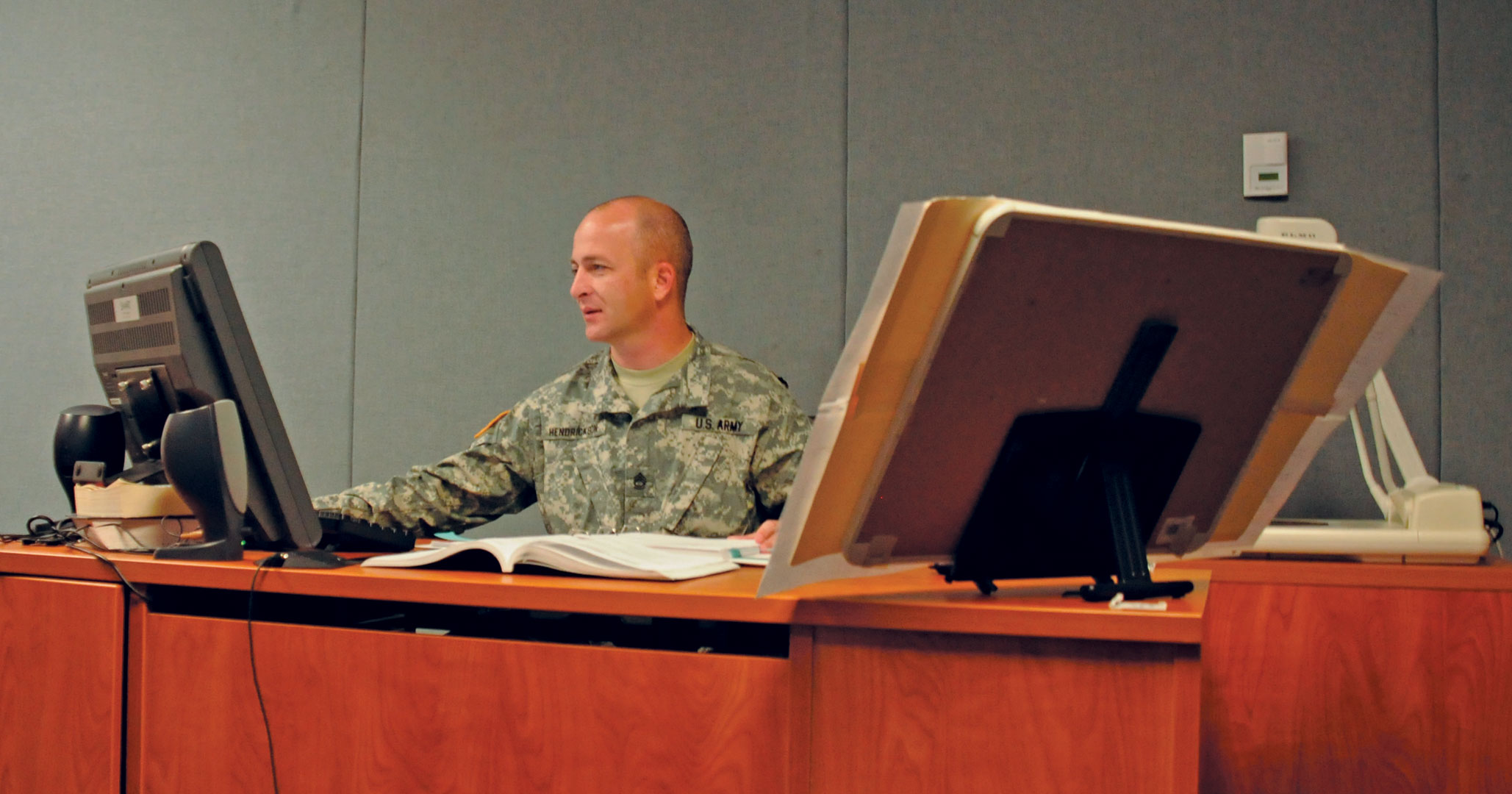 Sgt. 1st Class Kevin Hendrickson, a VTT instructor for the Battle Staff NCO Course at USASMA, prepares for an on-camera class session Nov. 7, 2012. (Photo by Staff Sgt. Jason Stadel)