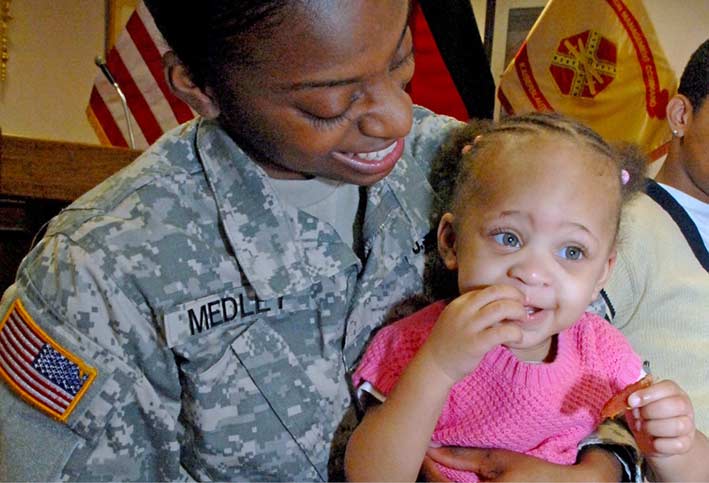 Spc. Anesha Medley, pictured with her daughter Serenity in 2011
