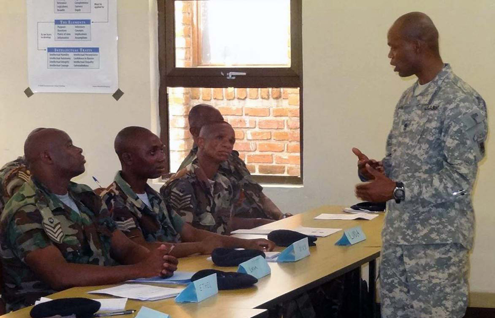 Sgt. Maj. Jerryn McCarroll, one of U.S. Army Africa’s African NCO Education System program managers, teaches a class at the NCO academy in Salima, Malawi. (USARAF photo)