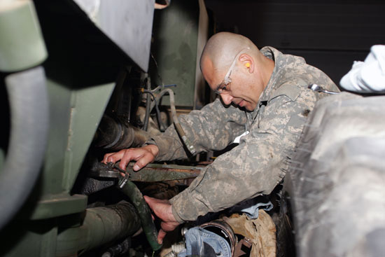Staff Sgt. Harold Quezada, from the 827th Engineer Company of Horsehead, N.Y., works on a grader engine while in training at the Senior Construction Equipment Repairer Course at Fort McCoy’s Regional Training Site-Maintenance. (Photo by Scott T. Sturkol)