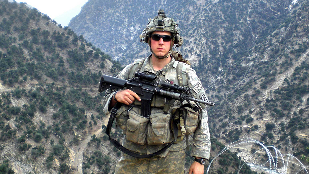 Then-Sgt. Ryan Pitts of “Chosen Company,” 2nd Battalion, 503rd Infantry Regiment, 173rd Airborne Brigade, takes a break from building a traffic control point northeast of Combat Outpost Bella, Afghanistan, in the spring of 2008. The traffic control point was on the road from COP Bella to Aranas, Afghanistan. (Photo courtesy of the U.S. Army)
