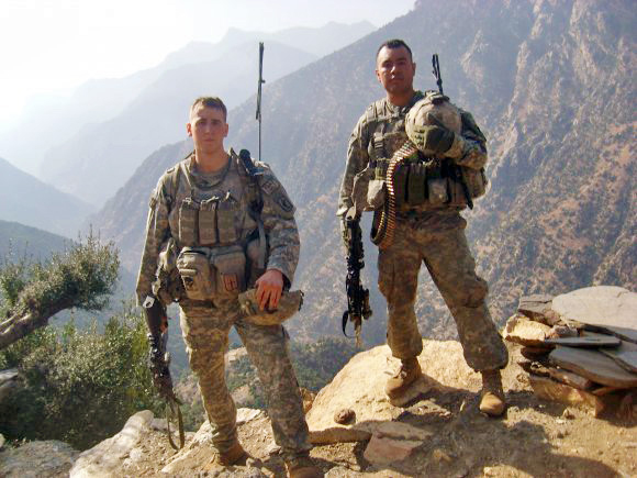 Then-Sgt. Ryan Pitts (left) and Sgt. Israel Garcia patrol the mountains of eastern Afghanistan in 2008. Garcia was among the nine Soldiers killed in the battle at Vehicle Patrol Base Kahler on July 13, 2008. (Photo courtesy of Staff Sgt. Ryan Pitts)