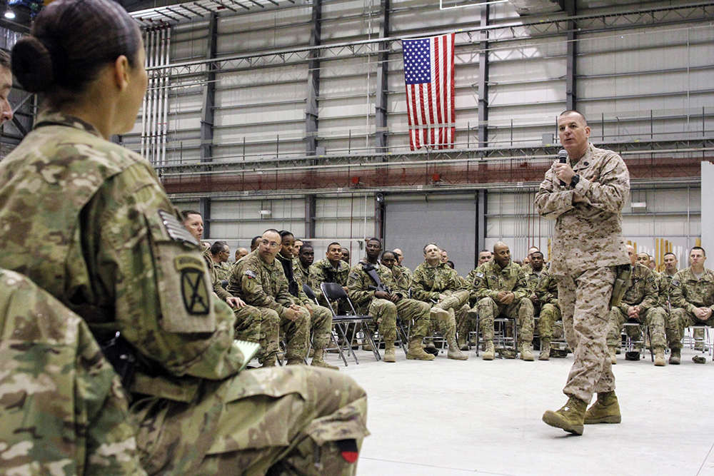 Marine Corps Sgt. Maj. Bryan Battaglia, the senior enlisted adviser to the chairman of the Joints Chief of Staff, speaks to a room of deployed troops at Bagram Air Field, Afghanistan, on March 15, 2014. (Photo by Master Sgt. Kap Kim)