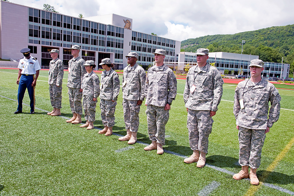 Sgt. 1st Class Thaddeus Martin, a tactical NCO at the U.S. Military Academy Preparatory School at West Point, N.Y., inspects new cadet candidates on their reception day in July 2013. (Photo by John Pellino)