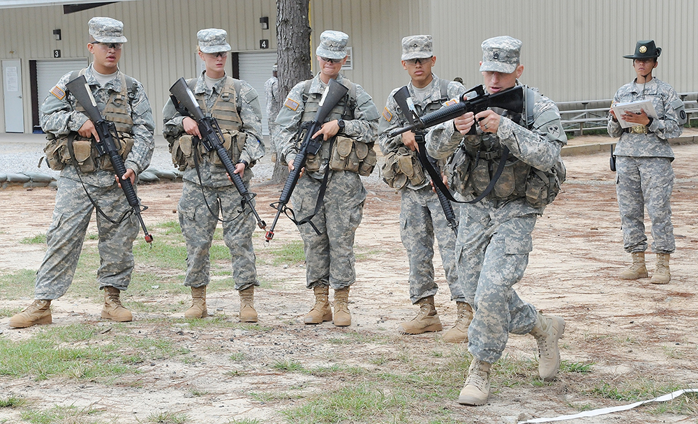 Staff Sgt. Derek Leonhardt (right) of A Troop, 5th Squadron, 15th Cavalry Regiment, 194th Armored Brigade, at Fort Benning, Ga., trains a group of Soldiers on how to clear a room Tuesday. Leonhardt was being tested on Warrior Tasks and Battle Drills as he strives to be the Drill Sergeant of the Year. (Photos by Jonathan (Jay) Koester)