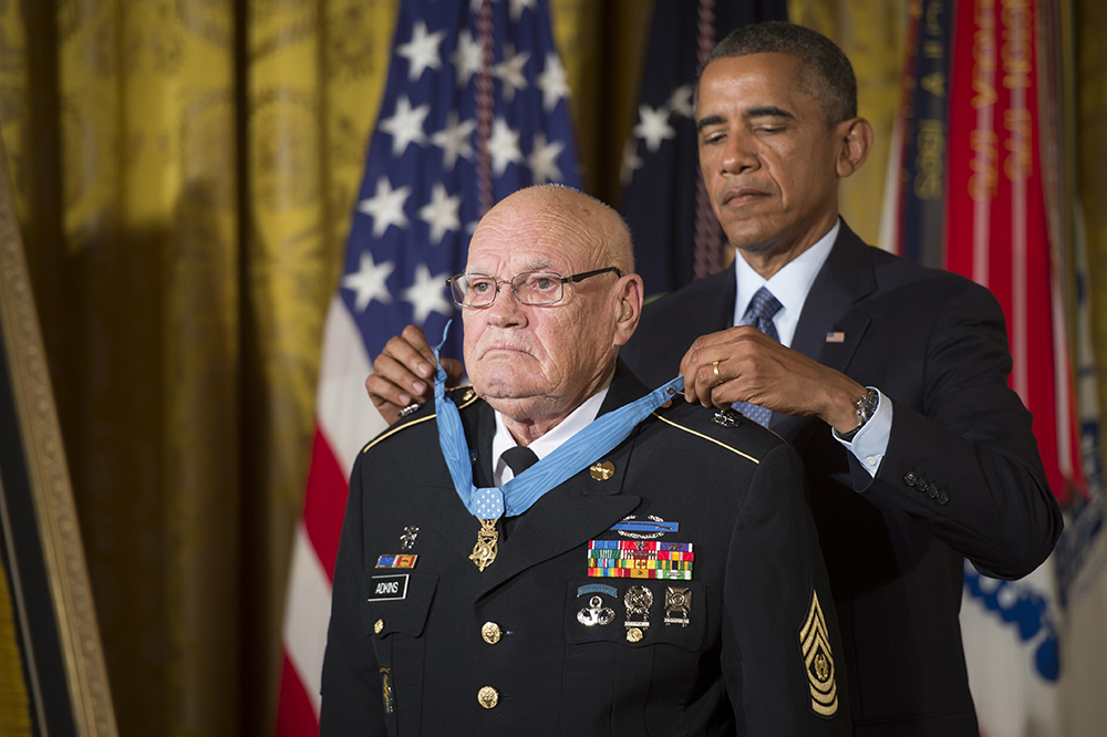 President Barack Obama bestows the Medal of Honor to retired Command Sgt. Maj. Bennie G. Adkins in the East Room of the White House, Sept. 15, 2014. (Photo by Staff Sgt. Bernardo Fuller)