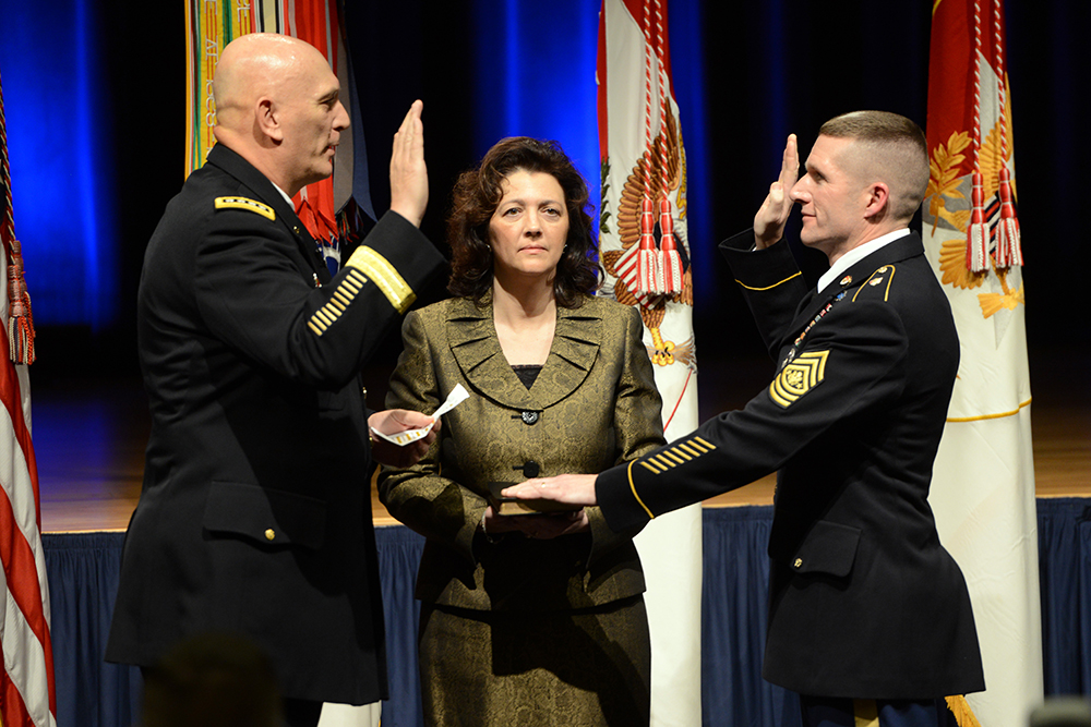 Chief of Staff of the Army Gen. Ray Odierno, left, administers the oath of office to the Sgt. Maj. of the Army Daniel A. Dailey, Jan. 30, 2015, at the Pentagon. Dailey’s wife, Holly, holds a bible. (Photo by C. Todd Lopez)