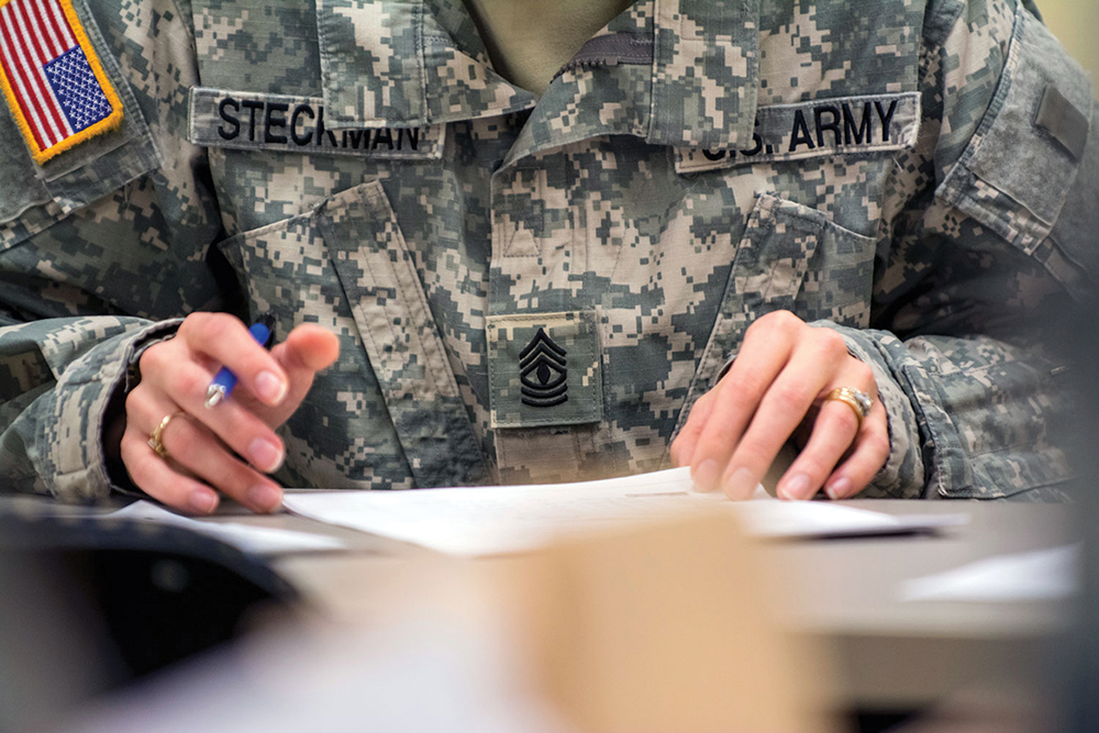 First Sgt. Raquel Steckman works on an operations order for a coming demolition range for the Army Reserve 374th Engineer Company (Sapper), headquartered in Concord, California. Steckman is the first woman in the Army appointed to a combat engineer company as a first sergeant. (U.S. Army photo by Sgt. 1st Class Michel Sauret)